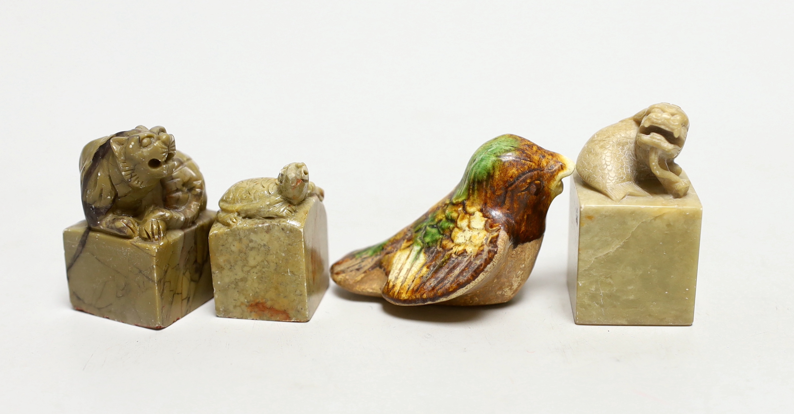Three Chinese soapstone seals, a pottery bird and a blanc de chine pot
